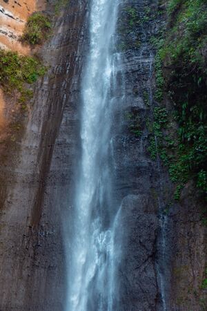 Sidoharjo Waterfall Located in Middle of Forest in Menoreh Highland, Indonesiaの写真素材