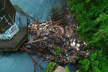 A Pile Of Garbage That Pollutes & Clogs The Riverの写真素材
