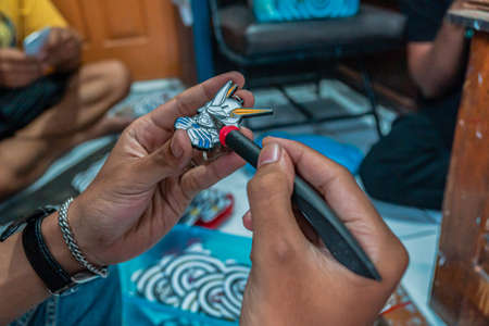 Craft pins made of acrylic and colored using enamel paint, all done by handmade from Yogyakarta, Indonesiaのeditorial素材