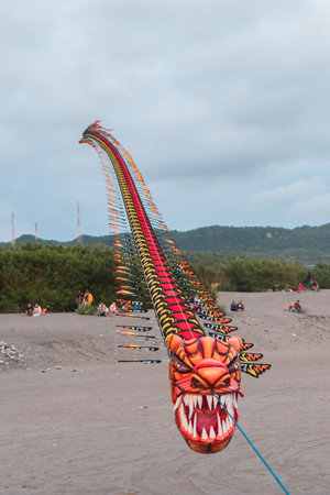 Dragon kites that fly in the sky of Parangtritis beach, Yogyakarta, Indonesia when the evening until...