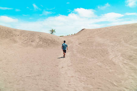 This very wide white sand dune located in Yogyakarta, Indonesia has become a rare sand dune and is crowded with tourists from within and outside the country.の写真素材
