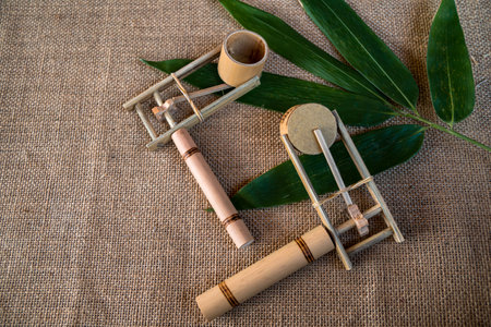 Details of some traditional Indonesian children's toys in the past, made of bamboo pieces that are handcrafted by local craftsmenの写真素材