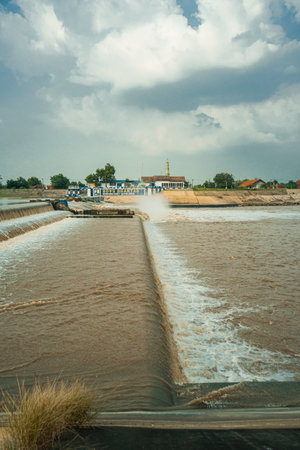 A rubber dam that divides the Brantas River in Jombang Regency, a rubber dam that regulates the flow of the Brantas River through Jombang Regency, East Java, Indonesiaの写真素材