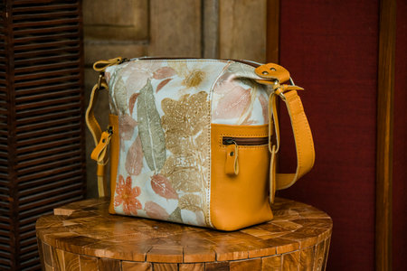Display of leather bags for women made by craftsmen in Indonesia. Various types of detailed & beautiful women's bags are combined with eco print artwork with leaf and flower motifsの写真素材