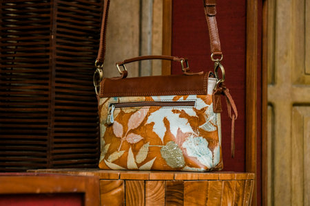 Display of leather bags for women made by craftsmen in Indonesia. Various types of detailed & beautiful women's bags are combined with eco print artwork with leaf and flower motifsの写真素材