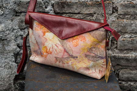 Display of leather bags for women made by craftsmen in Indonesia. Various types of detailed & beautiful women's bags are combined with eco print artwork with leaf and flower motifsの写真素材