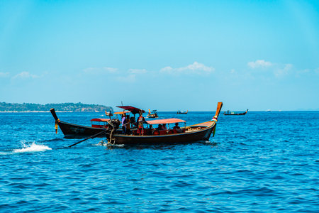 Speed boats and traditional boats in every corner of the sea in Krabi, Thailand. The vast Andaman Sea is a popular tourist destination with its many beautiful tropical islandsの写真素材