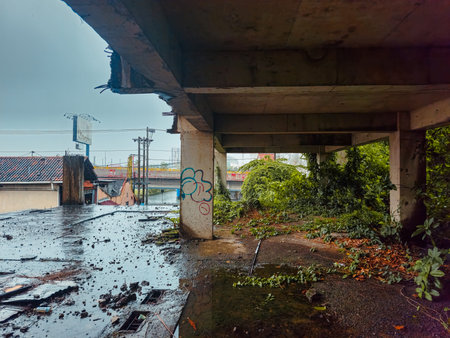 The inside of a former multi-storey building that was almost destroyed. An abandoned building with lots of puddles of rainwater, dirty and messyの写真素材