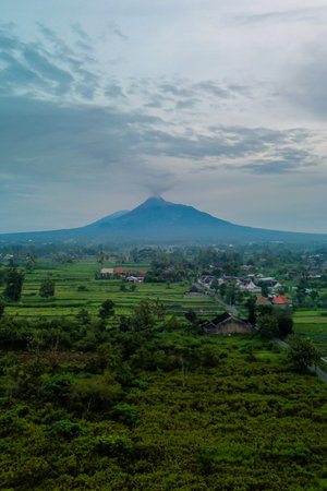 Aerial photo of the morning atmosphere in the countryside with a very majestic view of Mount Merapi...