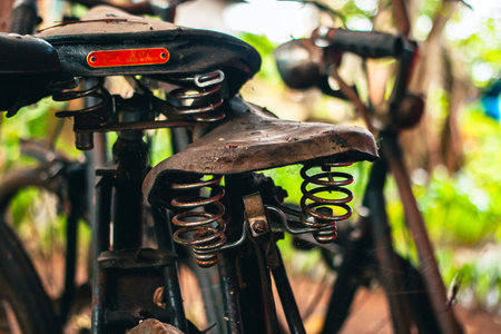 Close up of a classic bicycle full of rust and worn out. Details of old bicycle parts that are...