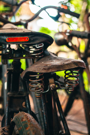 Close up of a classic bicycle full of rust and worn out. Details of old bicycle parts that are neglected and full of dust, look like they are starting to rust and become porousの写真素材