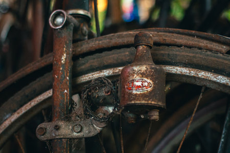 Close up of a classic bicycle full of rust and worn out. Details of old bicycle parts that are neglected and full of dust, look like they are starting to rust and become porousの写真素材