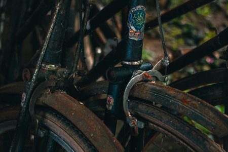 Close up of a classic bicycle full of rust and worn out. Details of old bicycle parts that are neglected and full of dust, look like they are starting to rust and become porousの写真素材