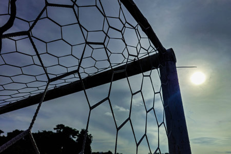 Detail of a soccer goal that is slightly rusty but still usable