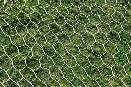 Detail of a soccer goal that is slightly rusty but still usable