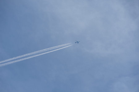 A jet plane flying in the blue sky.