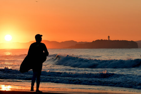 Sunrise and surfer (silhouette) in Shonan.
Chigasaki City, Kanagawa Prefecture, Japan.の写真素材