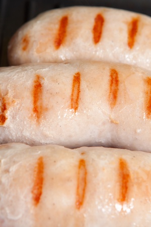 delicious fragrant grilled sausages with crispy stripsの写真素材