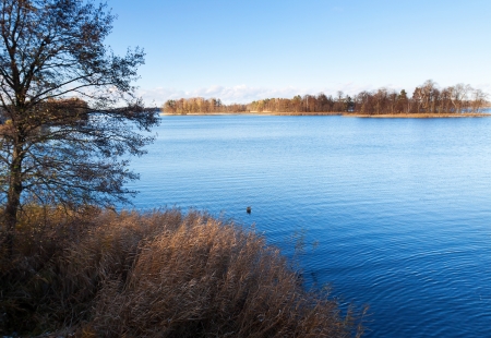 blue lake on a sunny autumn dayの写真素材
