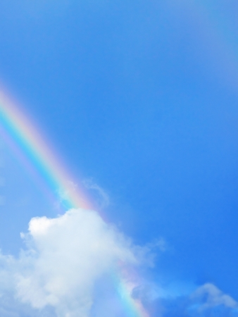 Natural background: rainbow against the clear skyの写真素材