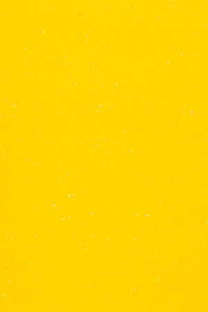 abstract background for design: a sheet of yellow colored cardboardの写真素材