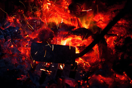 poker roll coal in the furnace, sparks fly