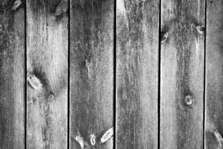 Old worn gray wall, natural planks in natural cracks and reliefs. Blank for your designの写真素材