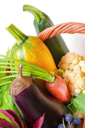 Farm products in a basket. Harvest vegetables and fruits from the gardenの写真素材