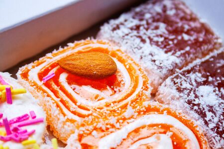 Turkish delight of various varieties with almonds, sprinkles and coconut flakes packed in a box. Turkish sweetsの写真素材