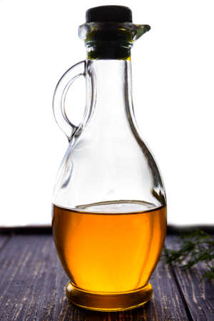 Glass bottles with olive oil on a dark backgroundの写真素材