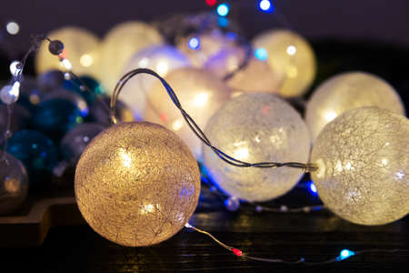 glowing balls of christmas garland with darkness, christmas decorの写真素材