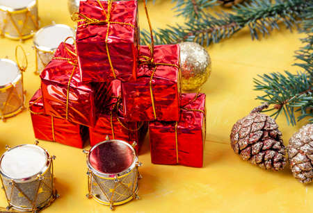 Small toys for the Christmas tree are scattered on the table - drums and balls, conesの写真素材