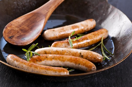 bratwurst roasted in the frypanの写真素材