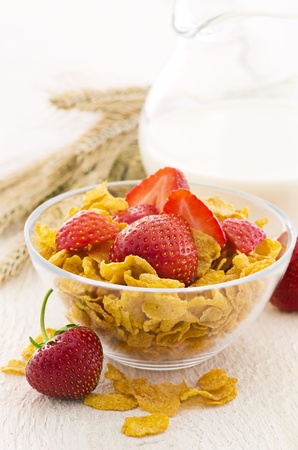 corn flakes with milk and strawberriesの写真素材