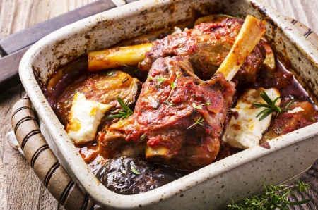 braised lamb knuckles with feta and aubergineの写真素材