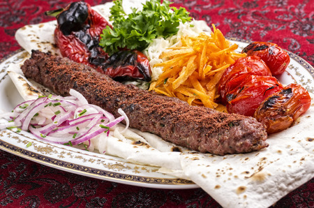 adana kebab with salad and flatbreadの写真素材