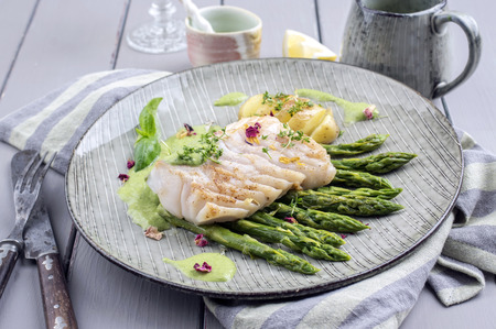 fish fillet with green asparagusの写真素材