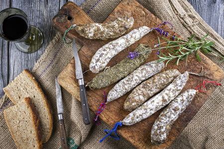 Salami on old cutting boardの写真素材