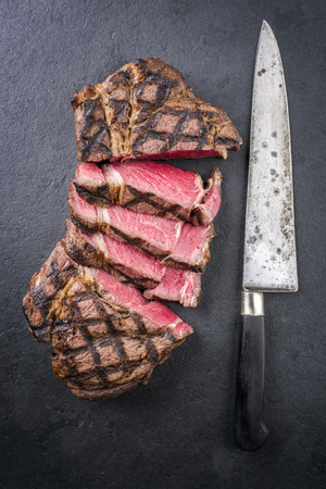 Barbecue dry aged Wagyu rib eye steak on a slateの写真素材