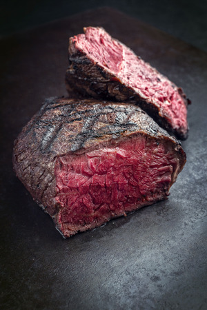Barbecue Wagyu Point Steak very rare sliced ??as close-up on a slateの写真素材
