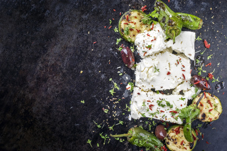 Traditional Greek feta with vegetable peppers isolated on a white backgroundの写真素材