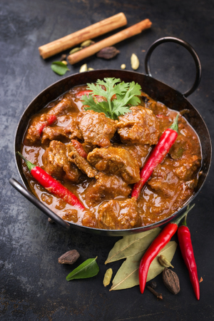 Traditional Indian curry lamb masala as close-up in a Korai