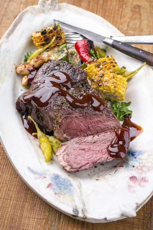 Barbecue wagyu chateaubriand with vegetable and maize as close-up on a plate の写真素材
