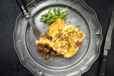 English shepherds pie as top-view on a pewter plateの写真素材