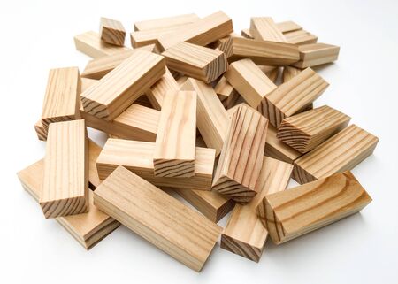 Wooden bars for a board game in a tower puzzle . Chaotic scattered on a white background.の写真素材