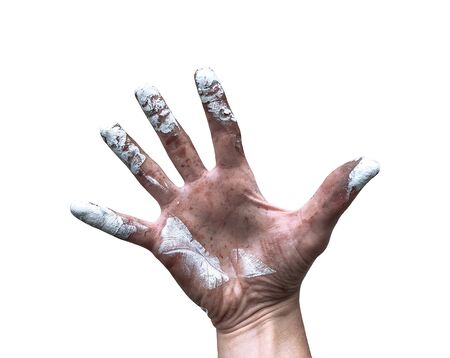 The male hand of a master is stained with paint, on a white background.の写真素材