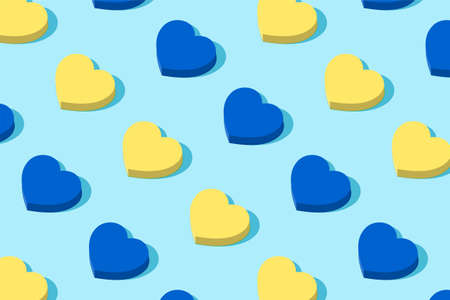 Fashionable pattern of geometric hearts. In the alternation of blue and yellow colors of the Ukrainian flag. Minimal holiday concept. Solar shadow.のイラスト素材