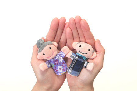 Puppet of the old couple in the handnursing careの写真素材
