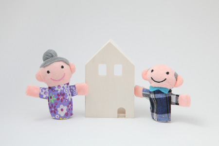 House and elderly of puppets on white background.の写真素材