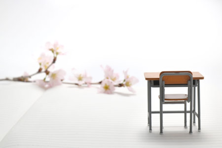 Study desk and cherry blossoms on the notebook.